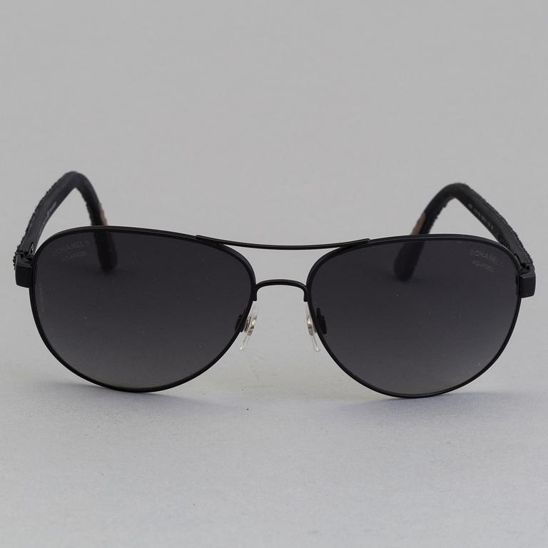 Chanel black pilot summer glasses.