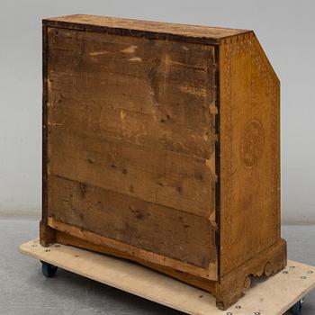 A carved oak secretaire, 19th Century.