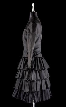 A black silk cocktail dress.