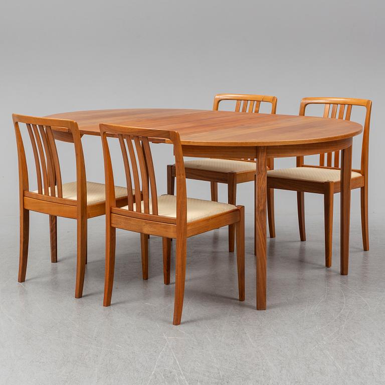 A 1950/60s teak and valnut table and four chairs.