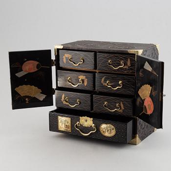 A Japanese lacquered cabinet, Meiji, circa 1900.
