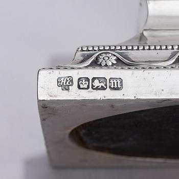 Four early 20th century silver candlesticks, marks of Hawksworth, Eyre & Co Ltd, Sheffield, England 1904-1906.