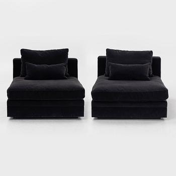 Two 21st century lounge chairs.