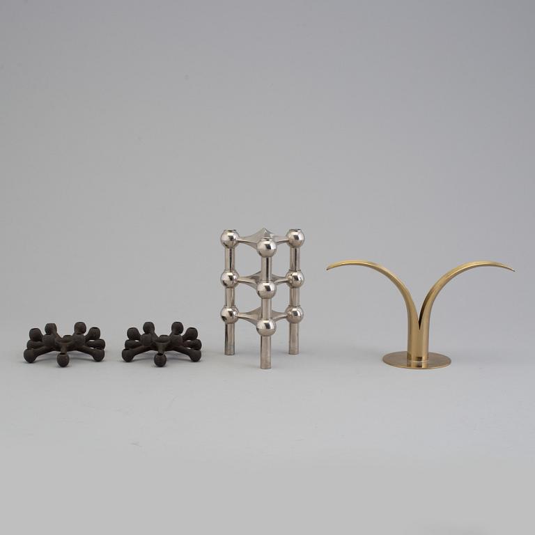 4 different candlesticks, including Ystad Metall, "Nagel" by Werner Stoff.