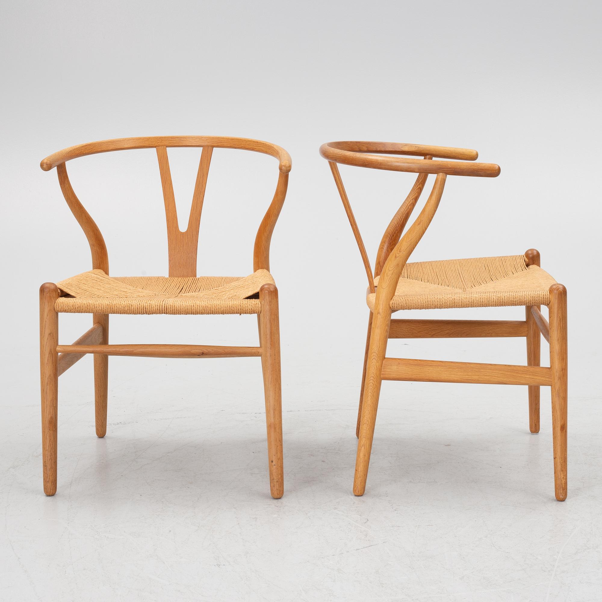 Hans J. Wegner, four model CH-24/ 'Wishbone' chairs, Carl Hansen, Odense, Denmark, second half of the 20th century.