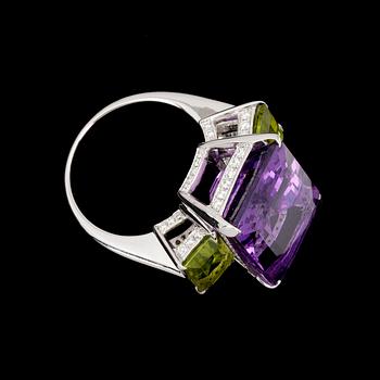 A stepcut amethyst, 17.37 cts, peridote and brilliant cut diamond ring.