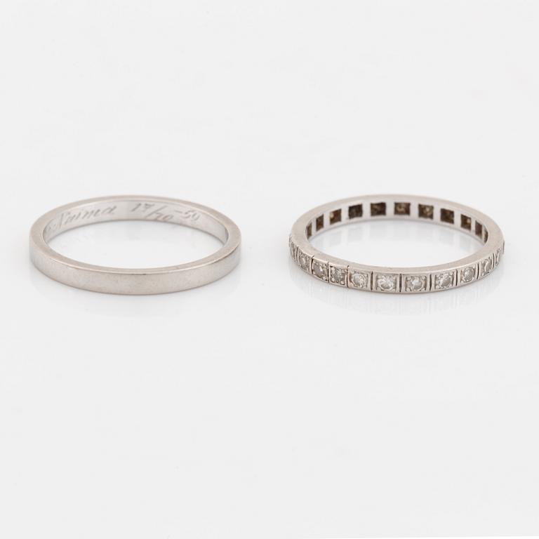 Two  platinum rings, one with eight cut diamonds.