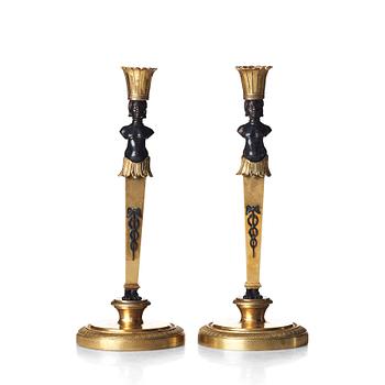 A pair of Empire style candlesticks. Late 19th century.