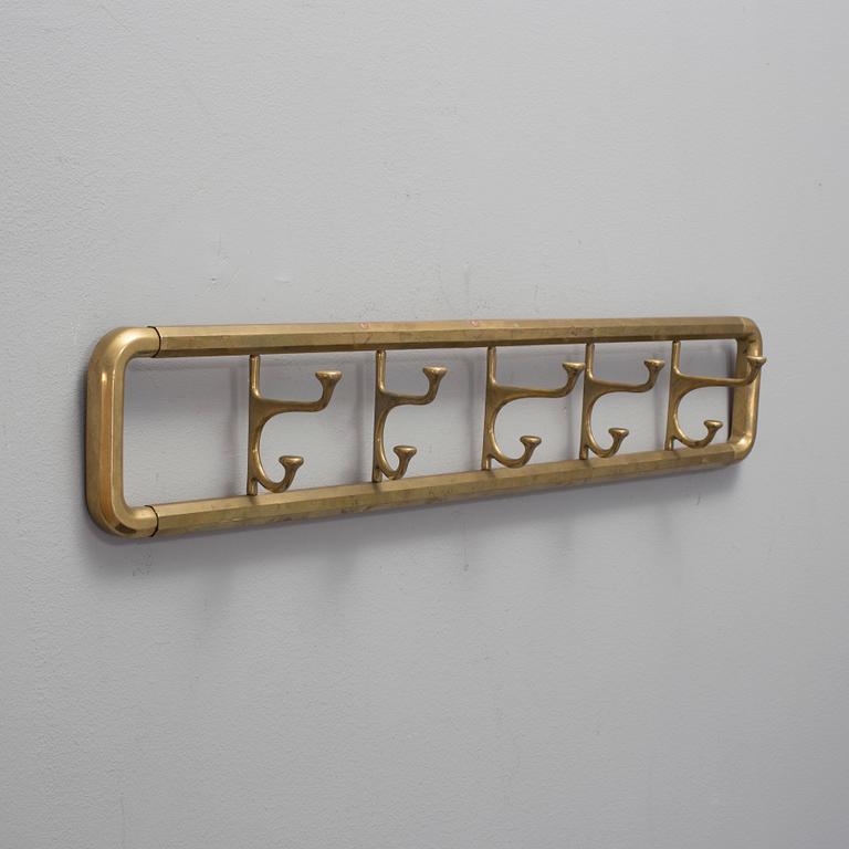 A BRASS COAT HANGER 1920'S.