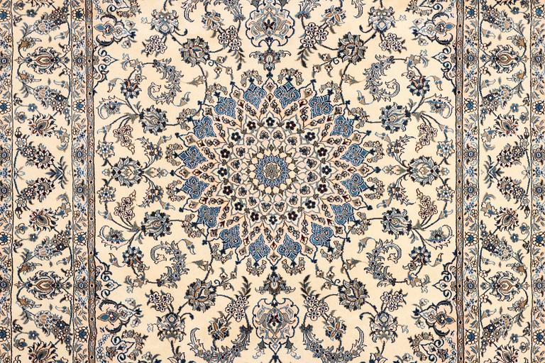 A Nain, part silk carpet, c. 337 x 244 cm.