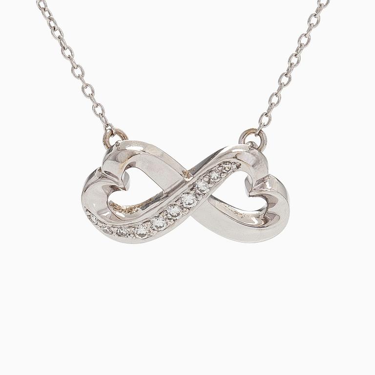 Tiffany & Co, Paloma Picasso, kaulakoru, "Double Loving Heart", 18K valkokultaa ja briljanttihiottuja timantteja.