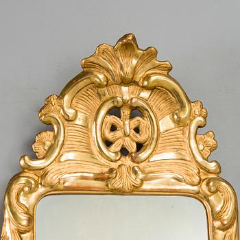 A Rococo mirror sconce, 18th Century.