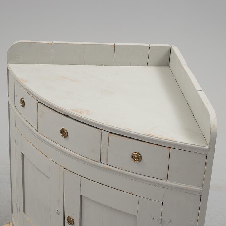 A mid 19th century corner sideboard.