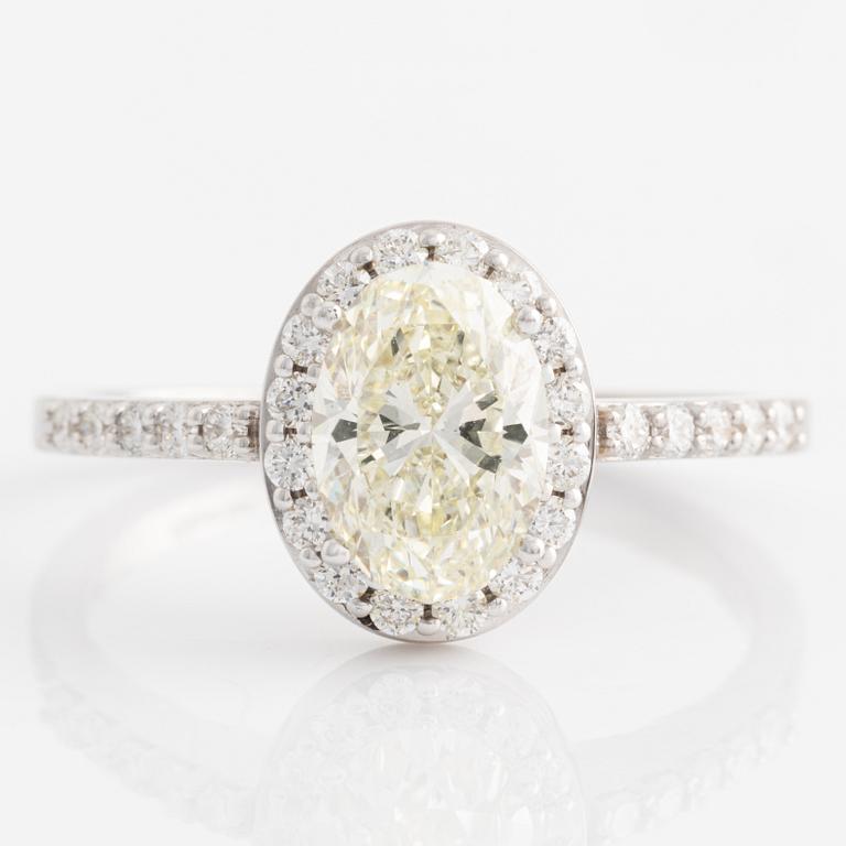 Ring with oval diamond, accompanied by GIA report.