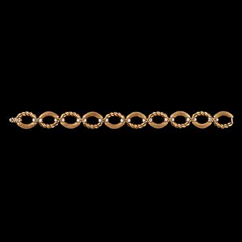 ARMBAND, Tiffany, guld med briljantslipade diamanter, tot. 1.20 ct.
