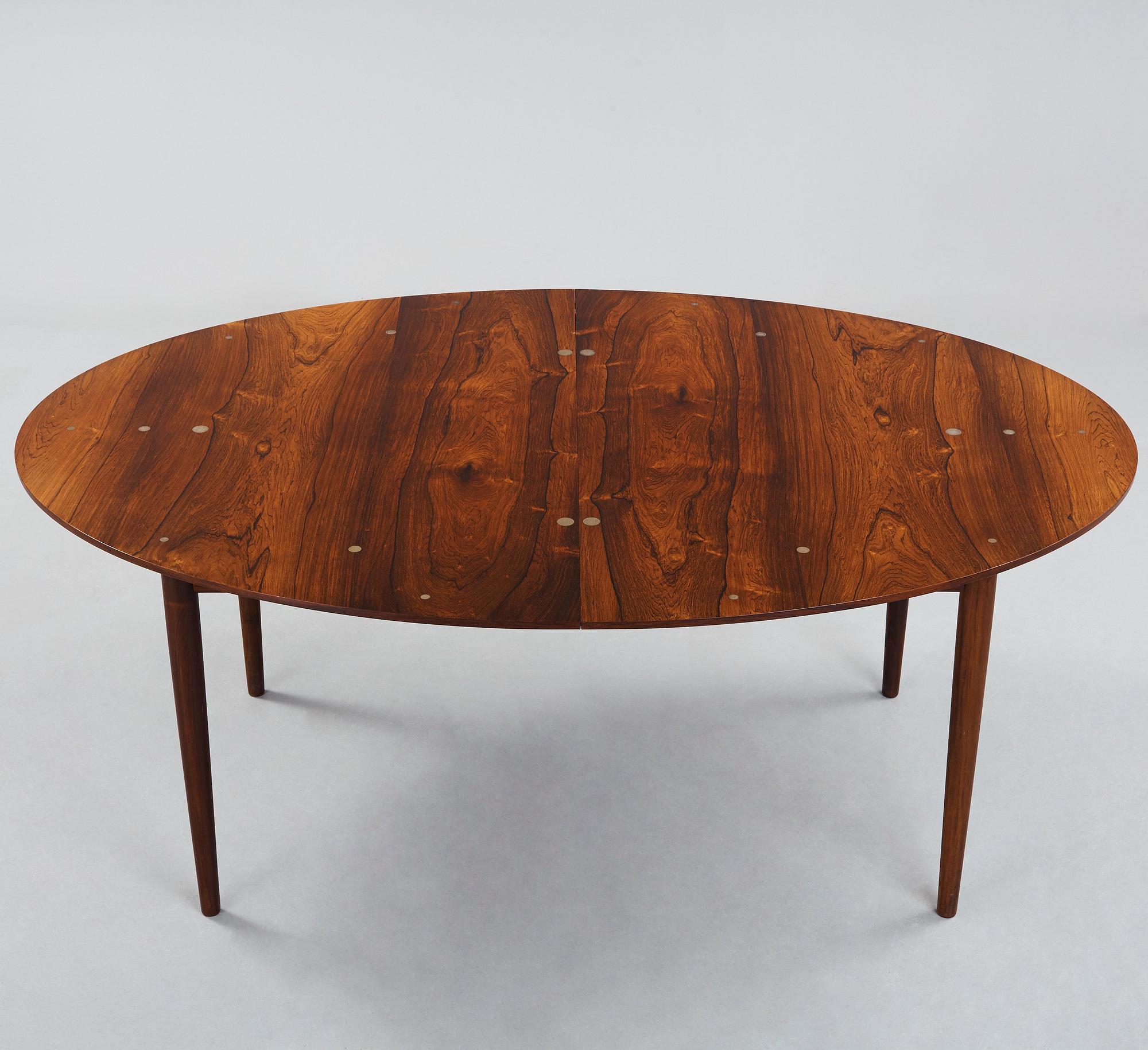 Finn Juhl, A Finn Juhl rosewood 'Judas' dining table, executed by Niels Vodder, Denmark 1960's.