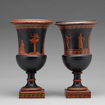 A matched pair of red figure glass vases, late empire, second half of 19th Century.