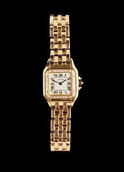 1130. A Cartier 'Panthére' gold and diamond ladie's wrist watch.