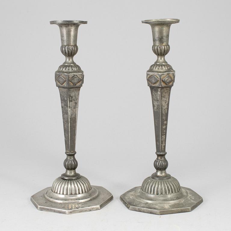 A pair of 18th century pewter candlesticks.