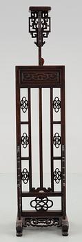 A hardwood lantern stand, with carved stylized dragons, presumably late Qing dynasty.