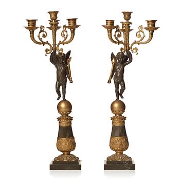 105. A pair of French Empire early 19th century four-light candelabra.