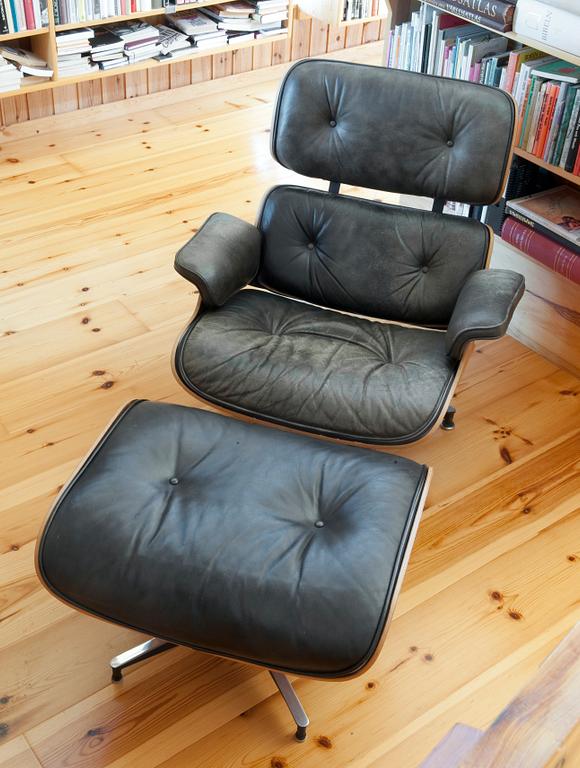 A LOUNGE CHAIR AND OTTOMAN,