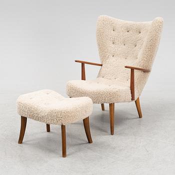 A lounge chair with foot stool by Schubell & Madsen. mid 20th Century.