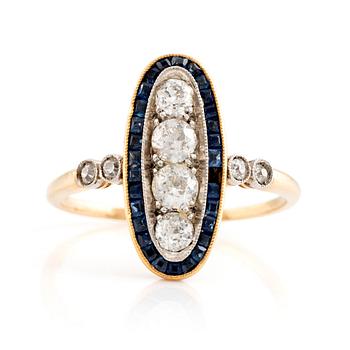An 18K gold and ring set with old-cut diamonds and step-cut sapphires.