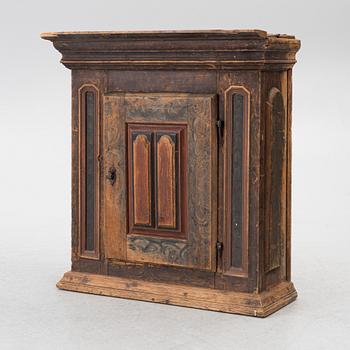 A polychrome-painted folk art hanging cabinet from Järvsö, Sweden, early 19th century.