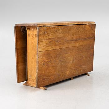 A drop-leaf table, 19th Century.