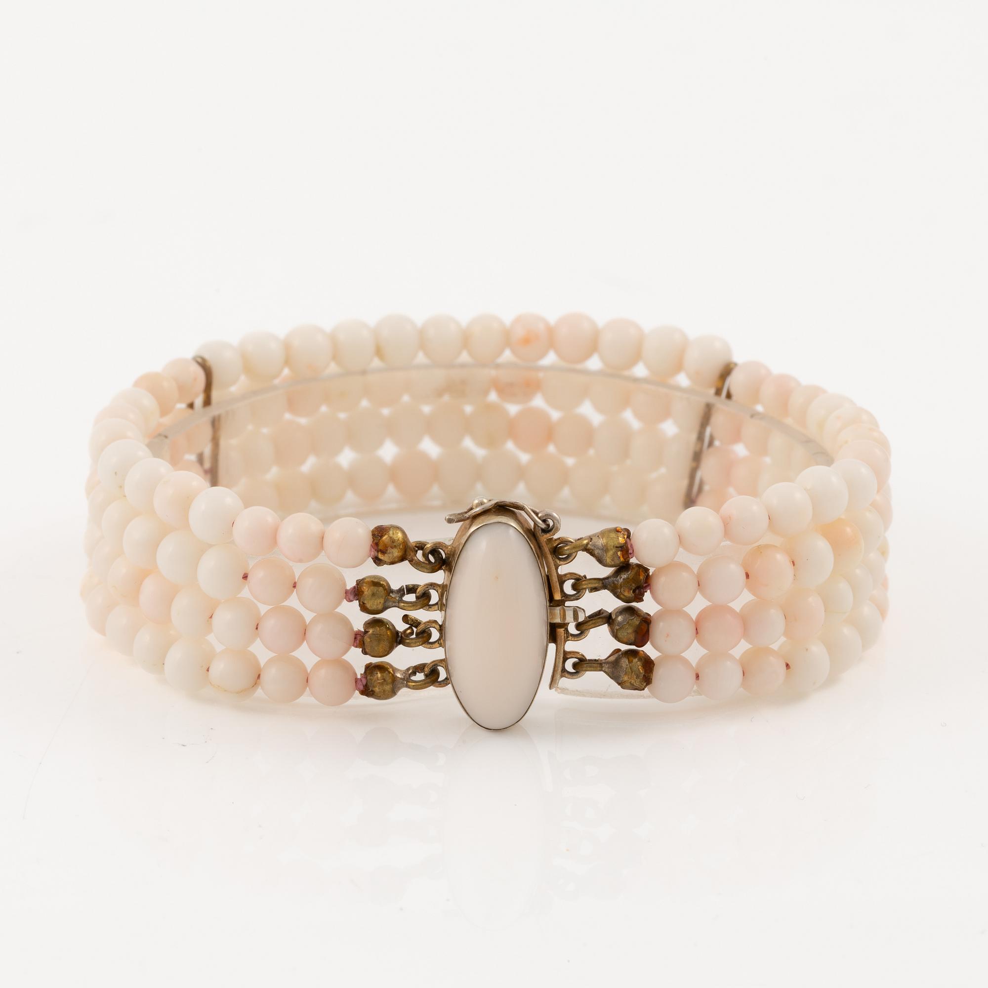 Bracelet with light pink coral, four strands.