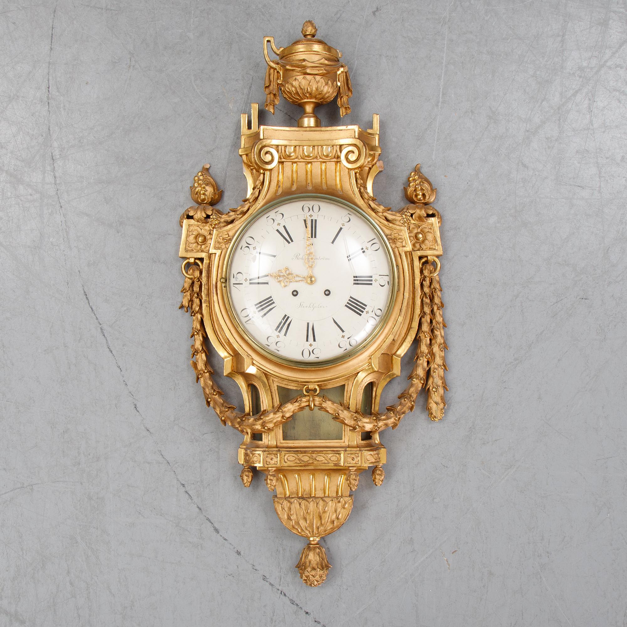 A gustavian style wall clock, signed Rob. Engström, Stockholm. First half of the 20th century.