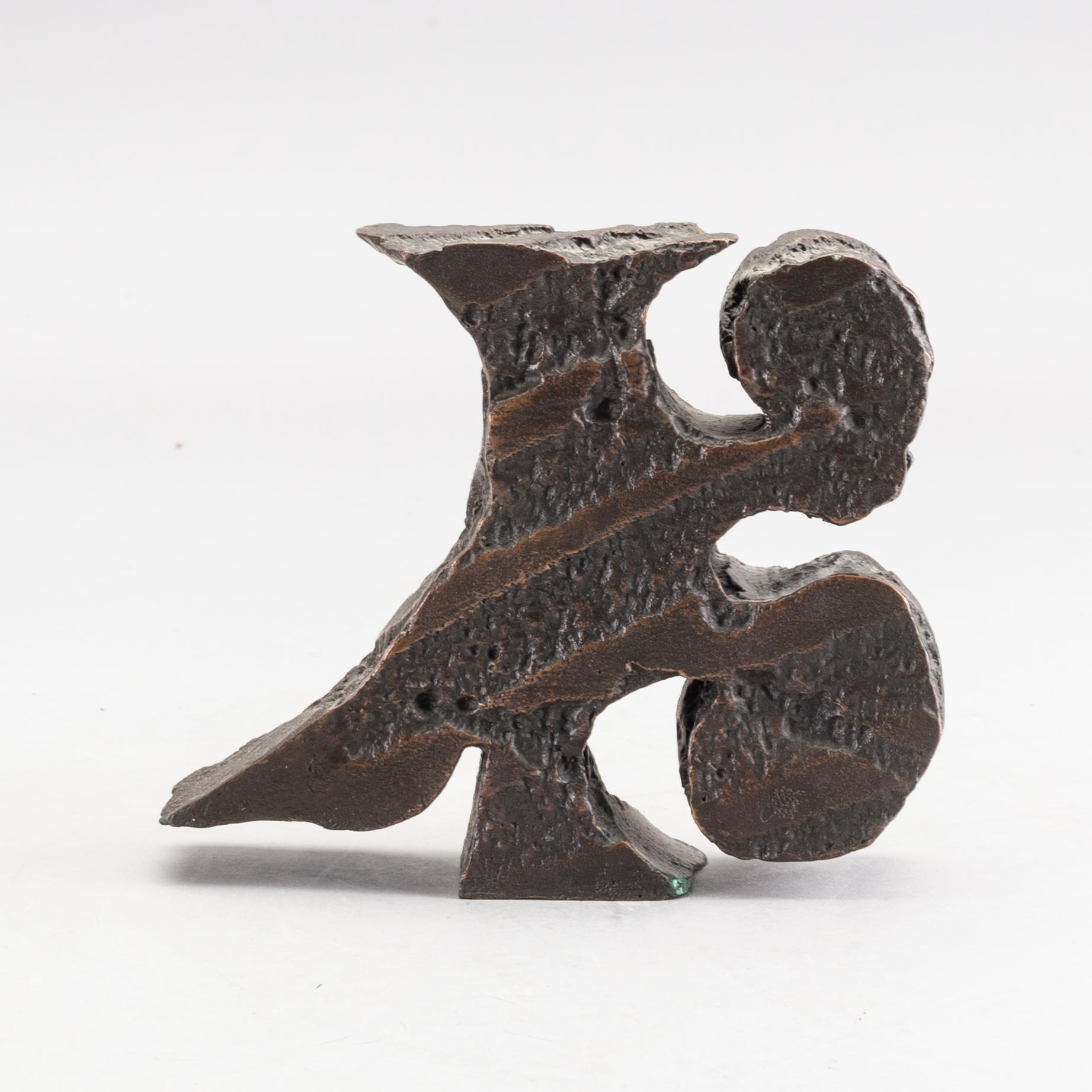 An signed and numbered bronze sculpture '23' by Carl Fredrik Reuterswärd.
