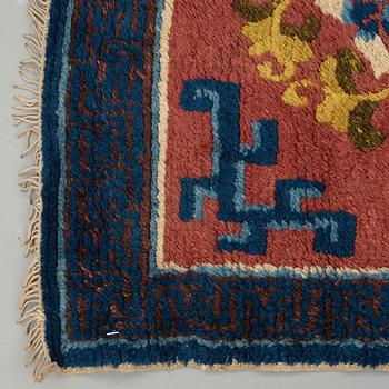 A MEDITATION CARPET, ten squares, a semi-antique Ningxia, China, ca 598,5 x 62 cm.