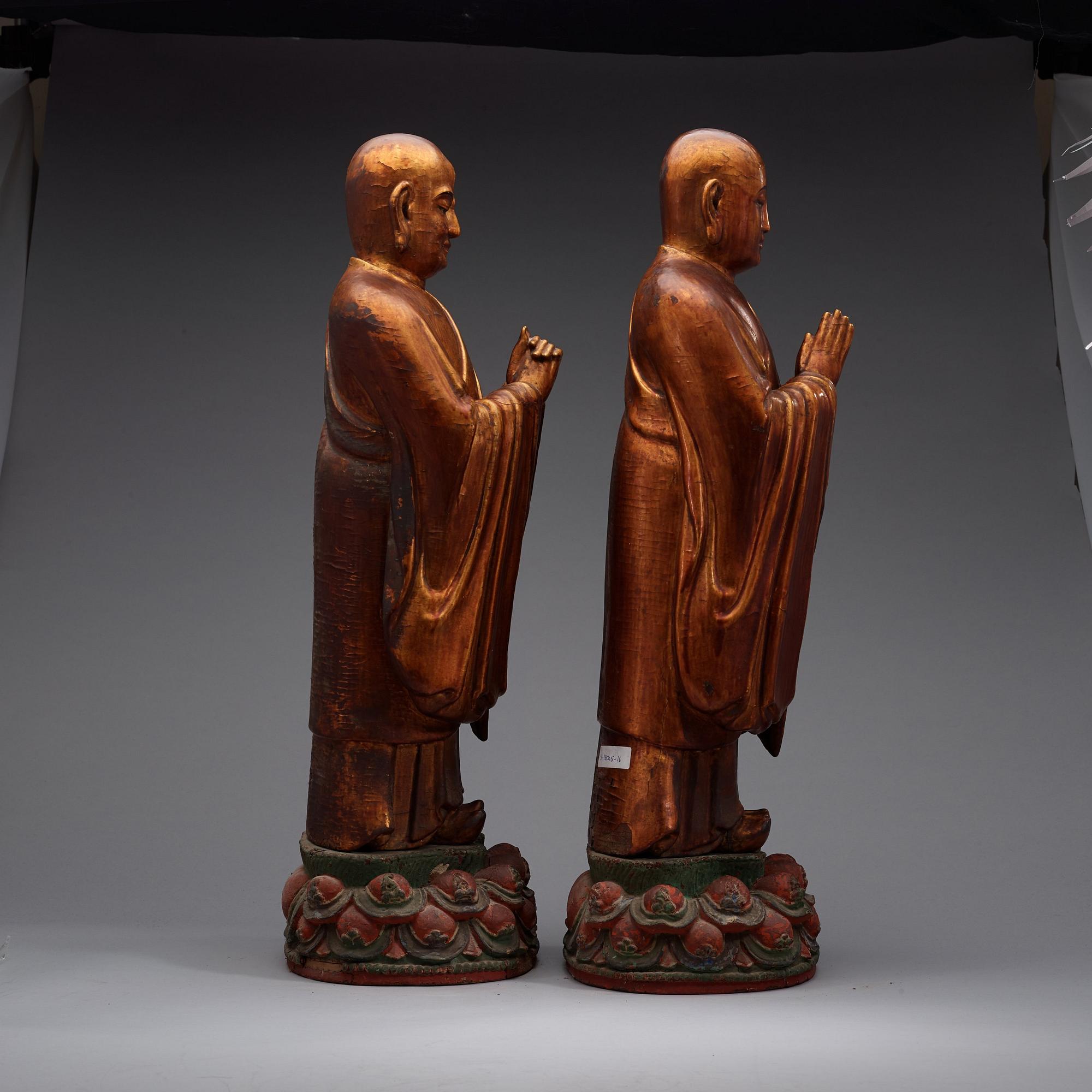Two gilt lacquered figures of lamas, Ming dynasty (1368-1644).