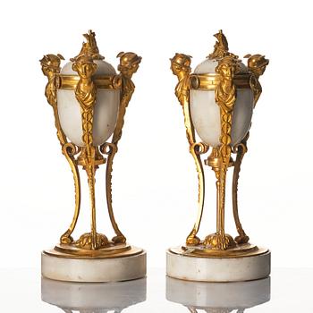 A pair of Louis XVI Cassolettes, white marble and gilt-bronze, around 1790.