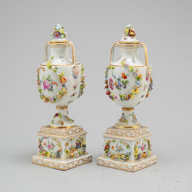 A pair of 19th century lidded vases, porcelain, Germany.