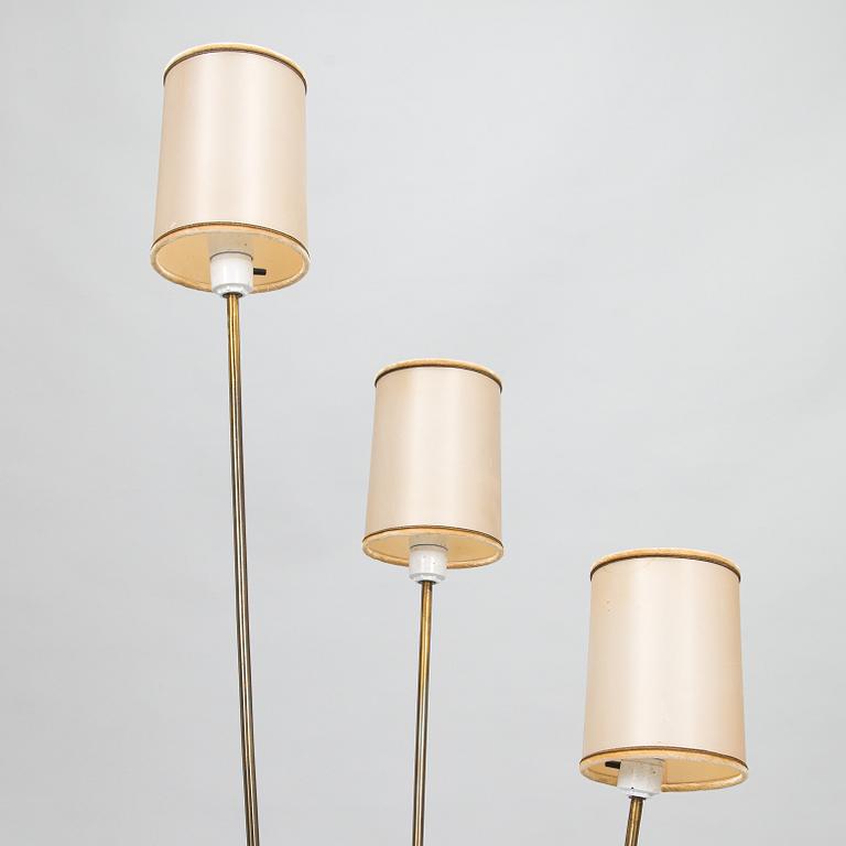 A mid-20th-century three-light floor lamp.