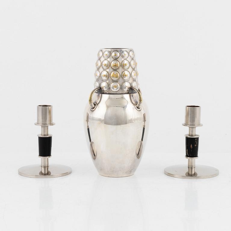 A pair of white metal candle holders, and a silver-plates vase, WMF, Germany, first half of the 20th century.