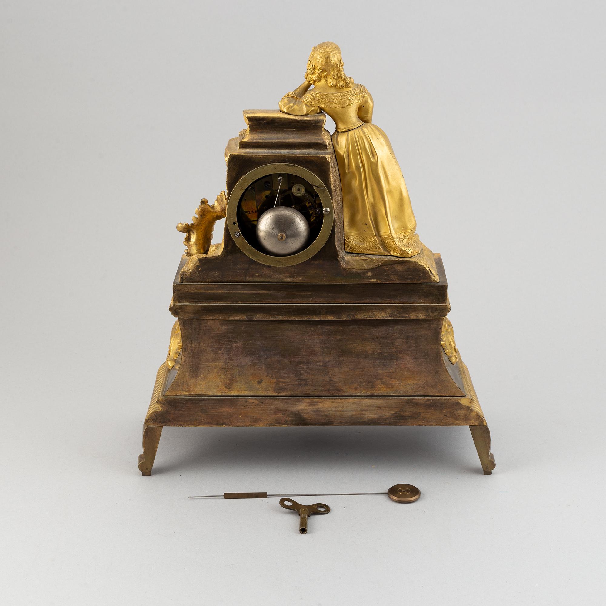 A rococo style brass mantle clock, second half of the 19th Century.