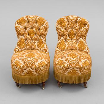 A pair of easy chairs, circa 1900.