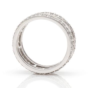 A ring with round, brilliant-cut and tapered, baguette-cut diamonds.