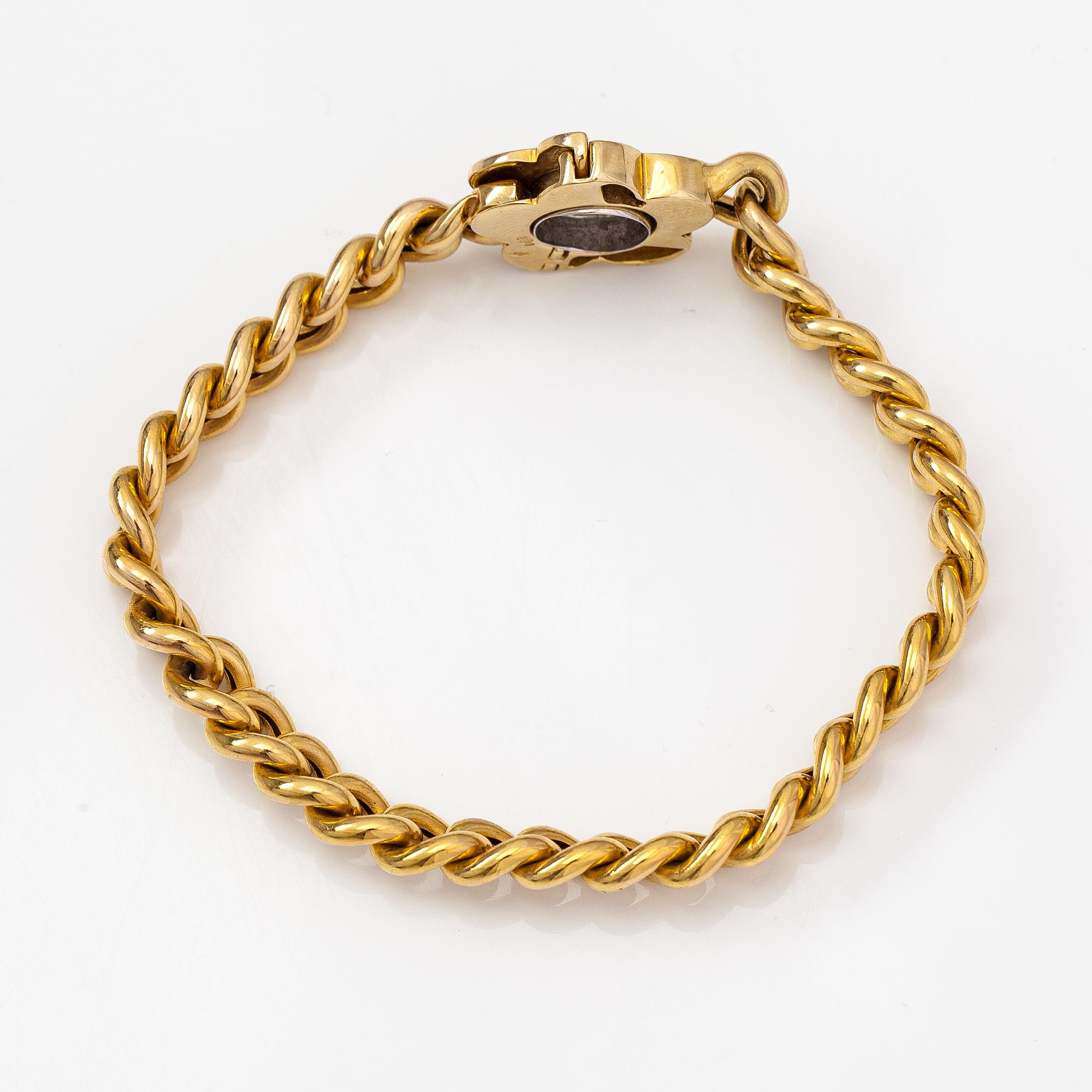 A 14K gold flower bracelet with diamonds ca. 0.38 ct in total. Finnish import marks 1966.