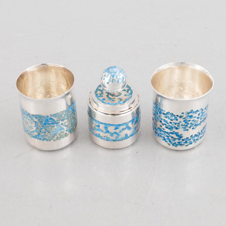 Two sterling silver and enamel miniature beakers and a small box with lid, marks of Lars Arby, Gothenburg, Sweden.