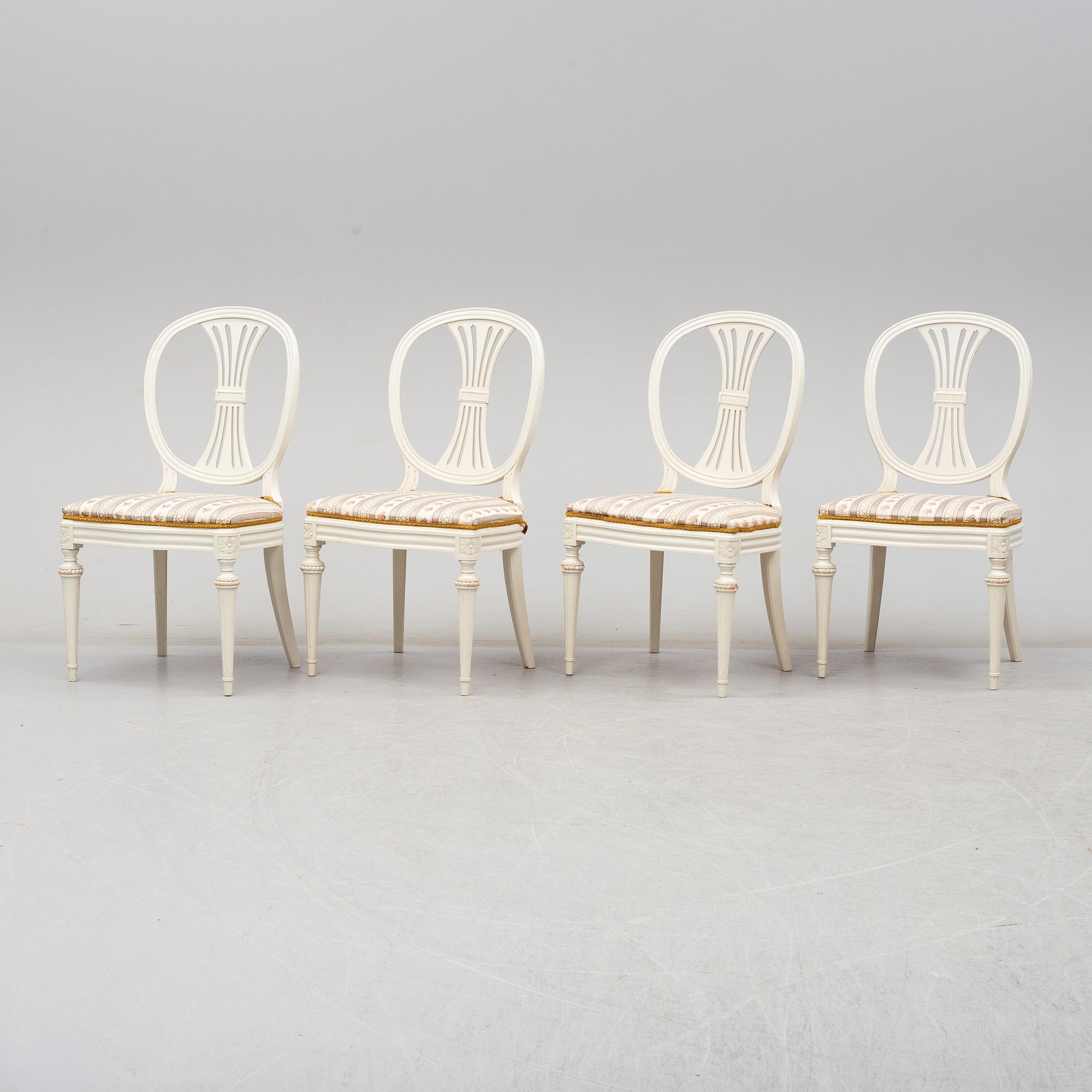 Four chairs with dinner table, late 20th Century.