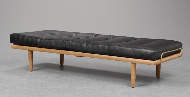 A Hans J Wegner oak and black leather daybed, Getama, Denmark 1950-60's.