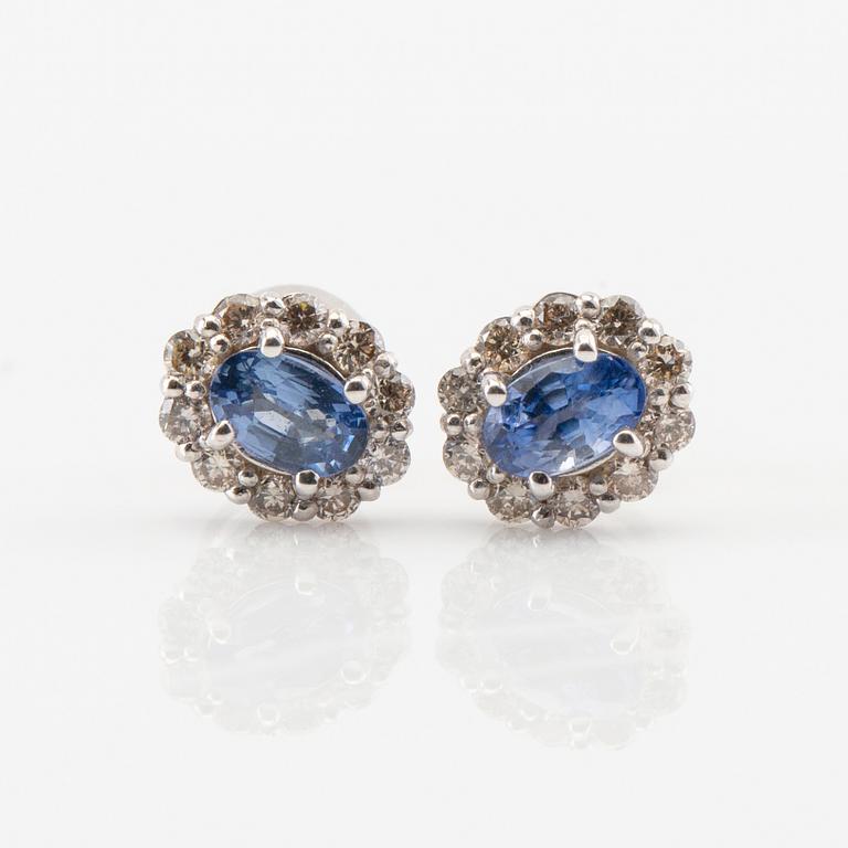 Earrings in 18K white gold with oval faceted sapphires and round brilliant-cut diamonds.