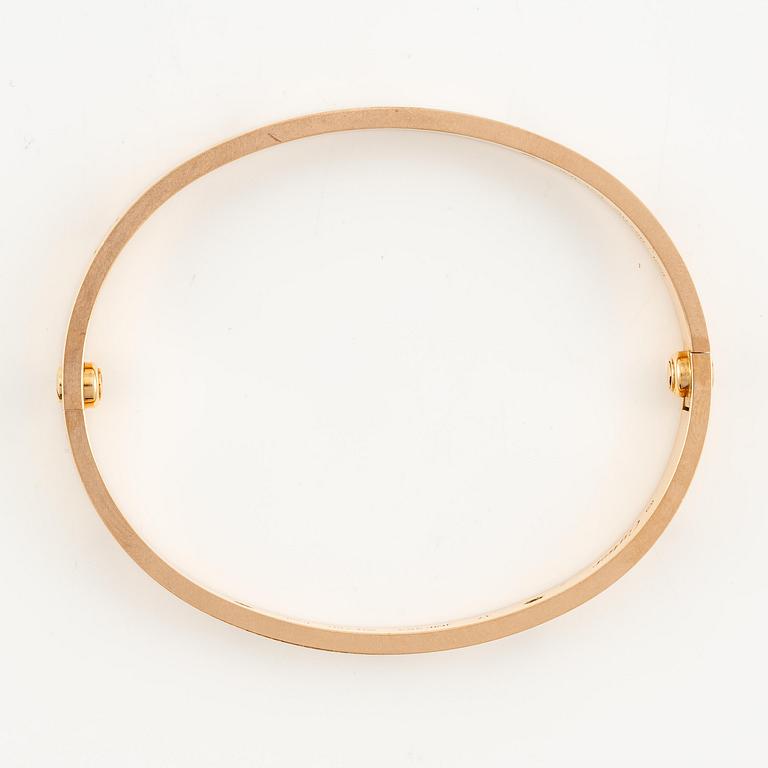 A Cartier "Love" bracelet in 18K rose gold with round brilliant-cut diamonds.