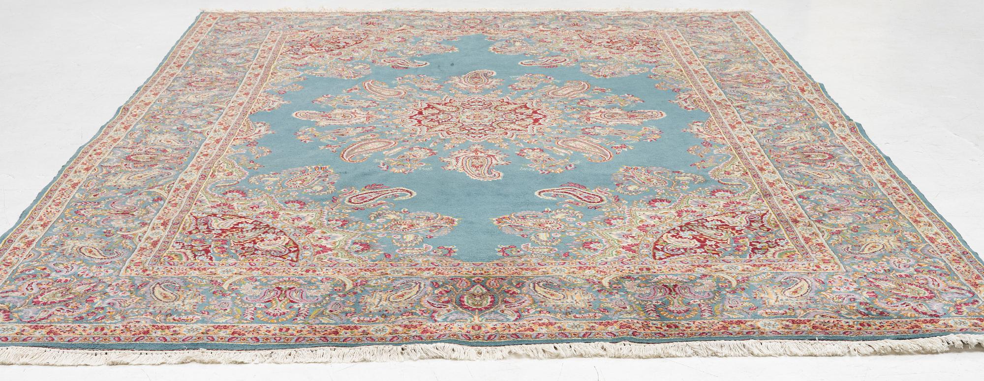 A Kirman carpet, c. 335 x 232 cm.