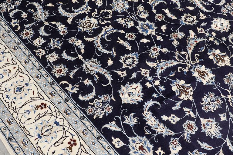 A carpet, Nain, part silk, ca 350 x 247 cm.